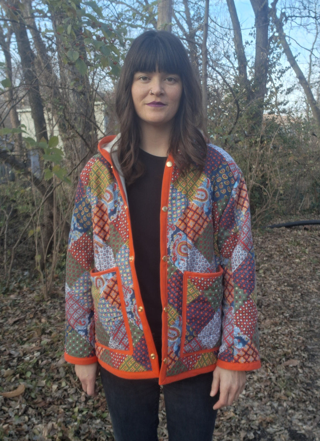 Orange, horseshoe print quilt coat
