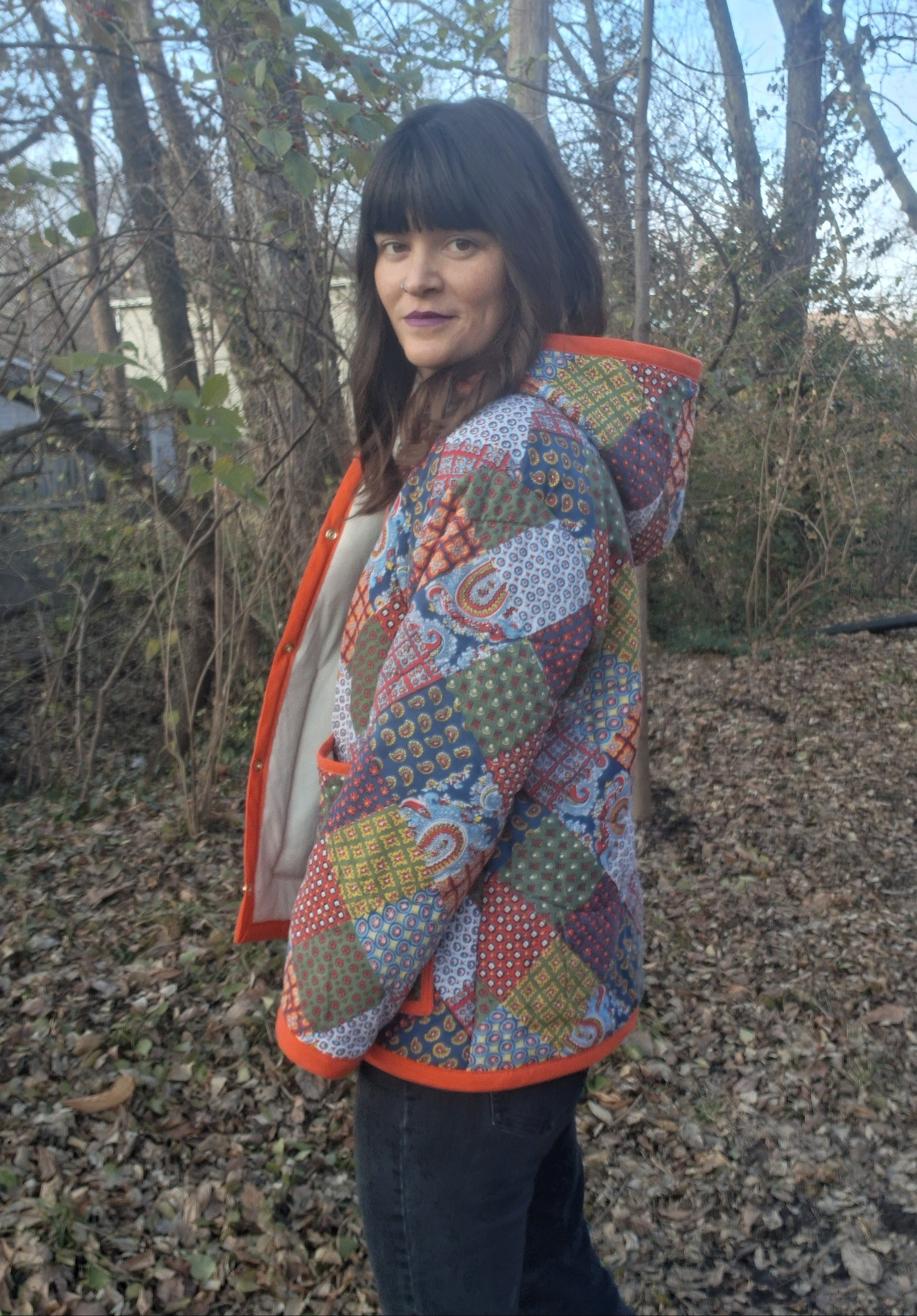 Orange, horseshoe print quilt coat