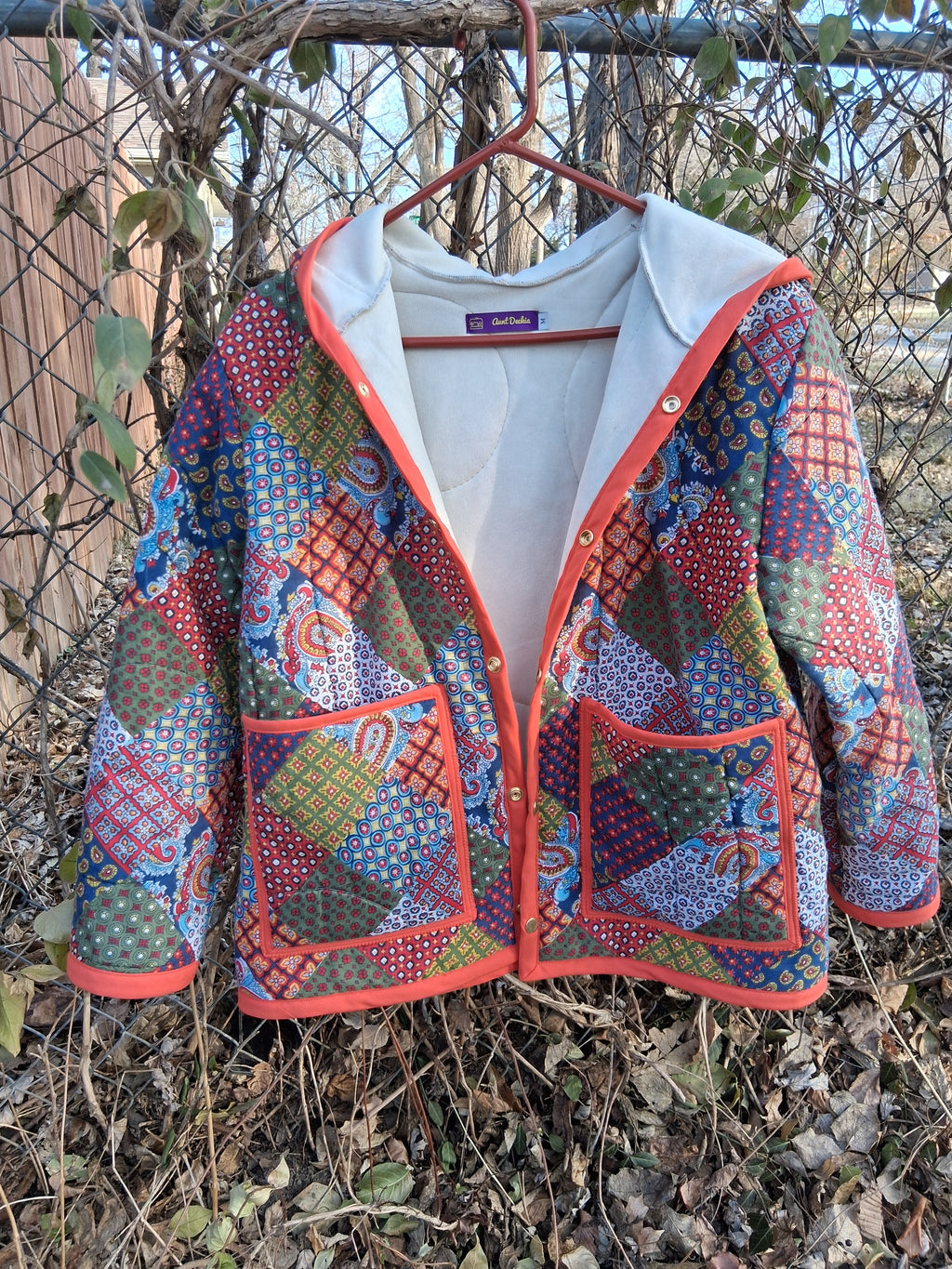 Orange, horseshoe print quilt coat