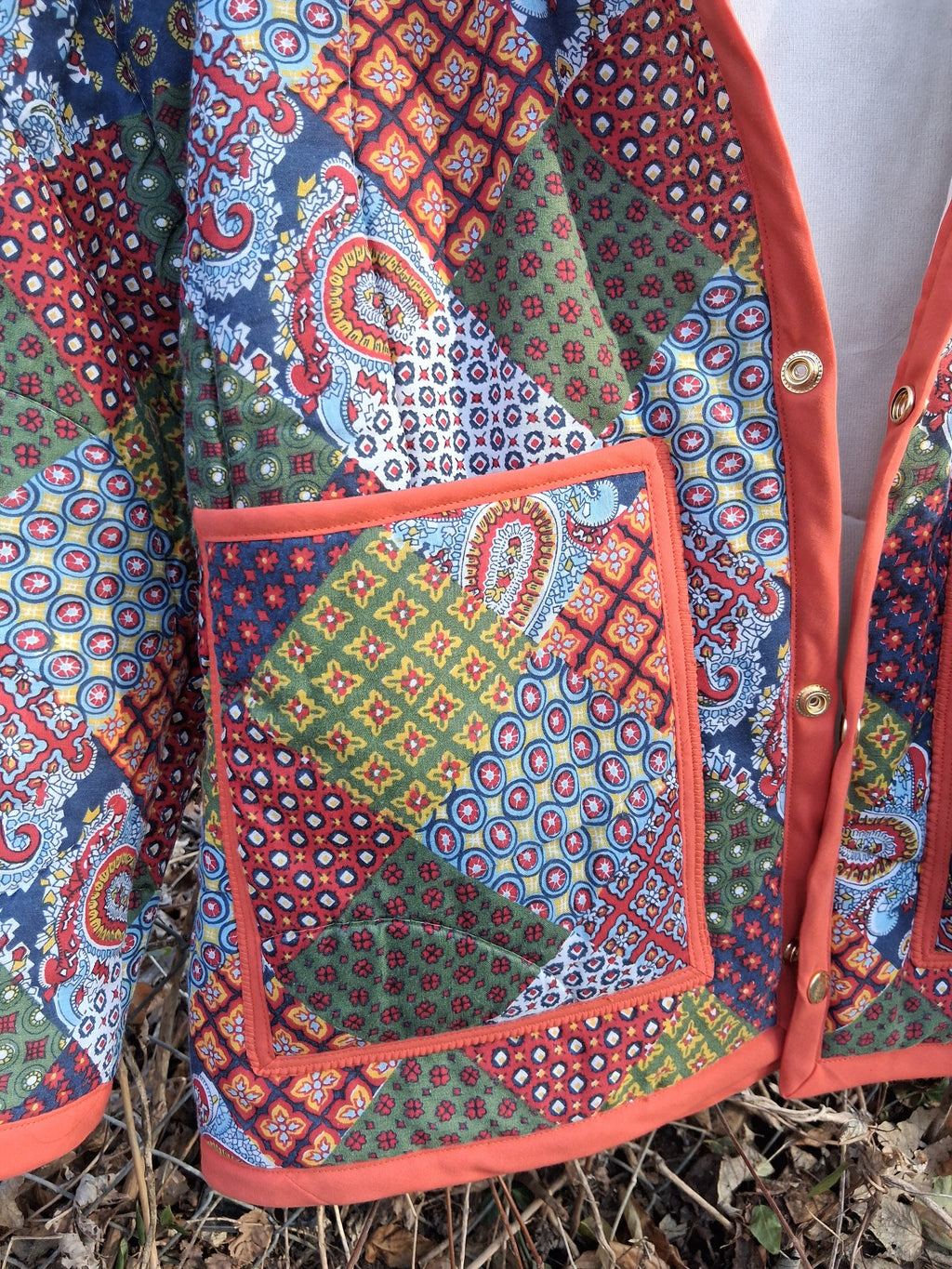 Orange, horseshoe print quilt coat